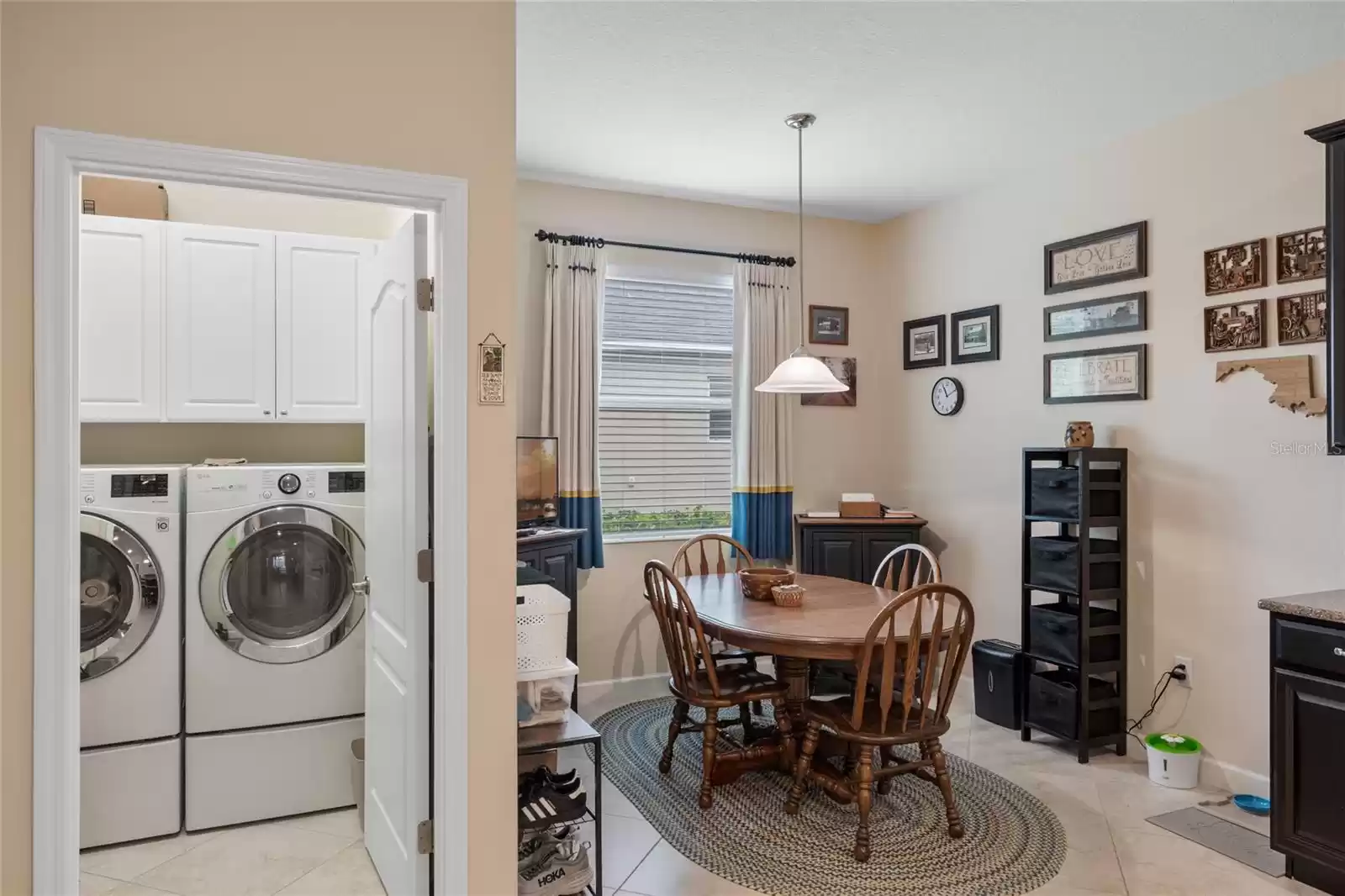 Breakfast nook showing the laundry area from the kitchen