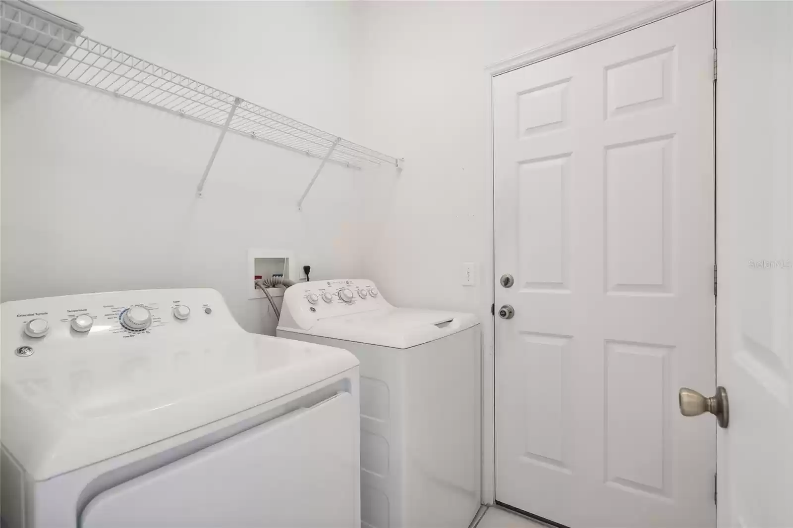 Indoor laundry room.  Washer & Dryer convey!