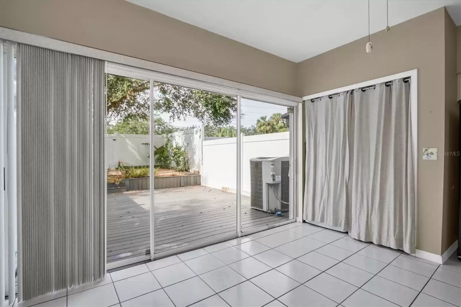 Kitchen leads to to a private patio