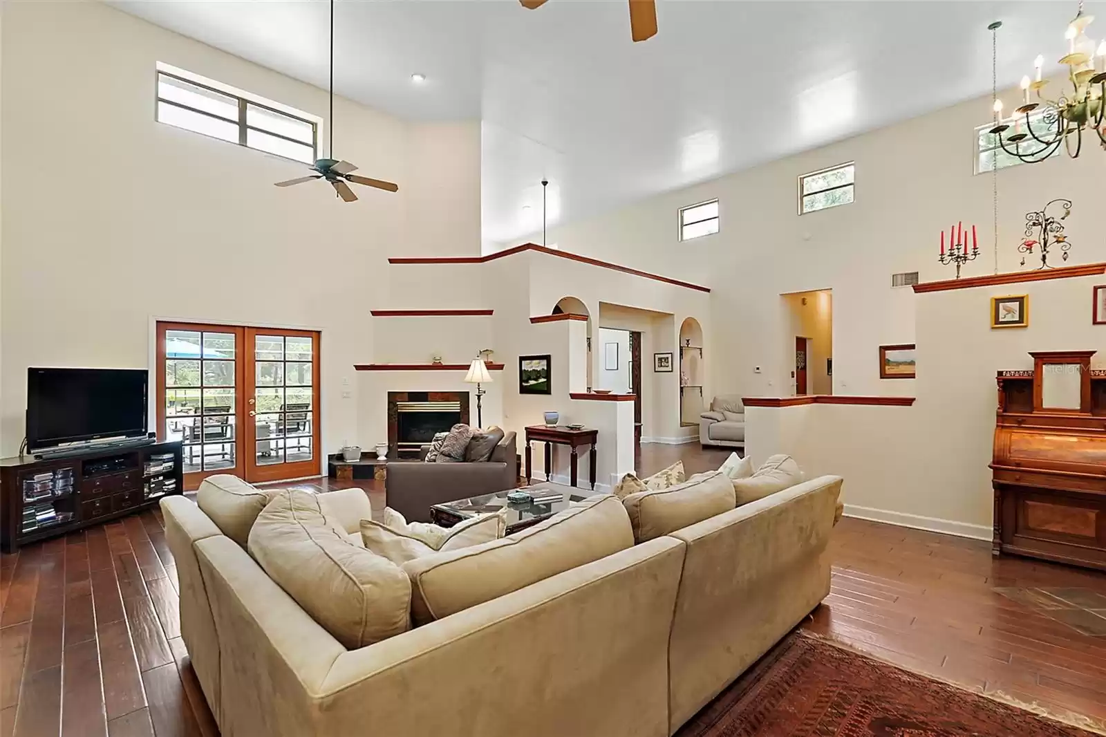 View from the two secondary bedrooms into the living room and dining rooms, toward the family room and kitchen. The added clerestory windows fill the rooms with light.