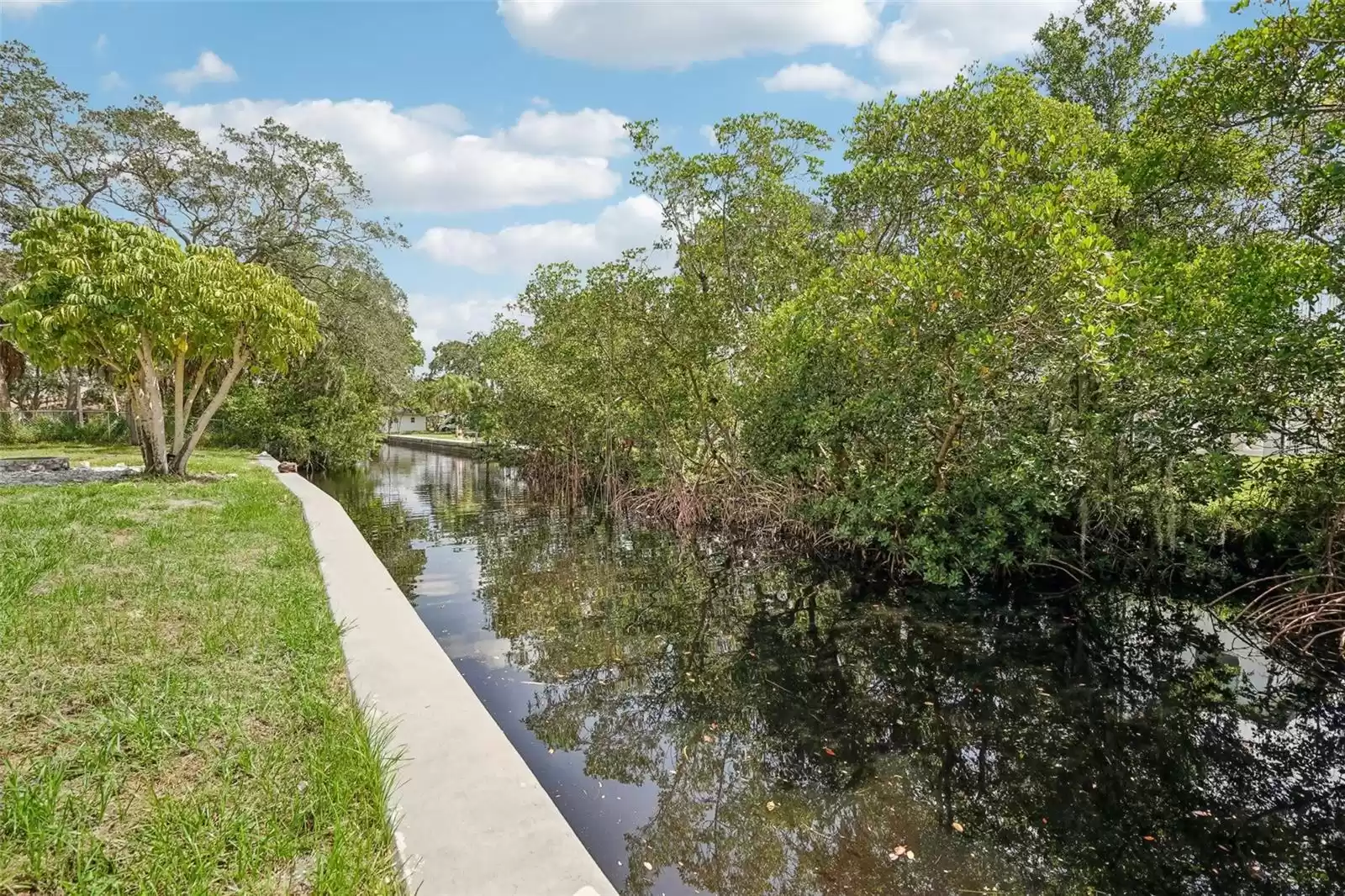 180' of canal-front/water access. Mangroves on opposite side of canal provide privacy from house on the other side.