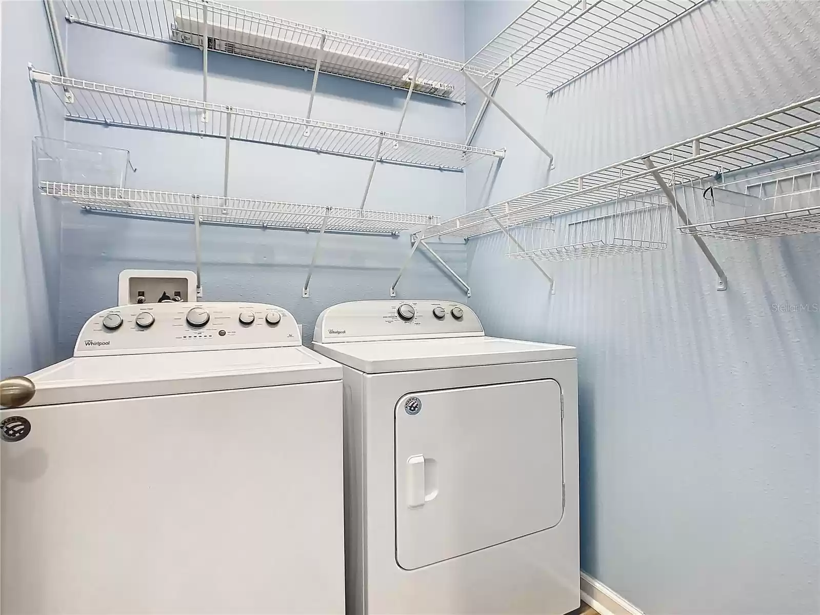 Inside laundry has had shelving installed.