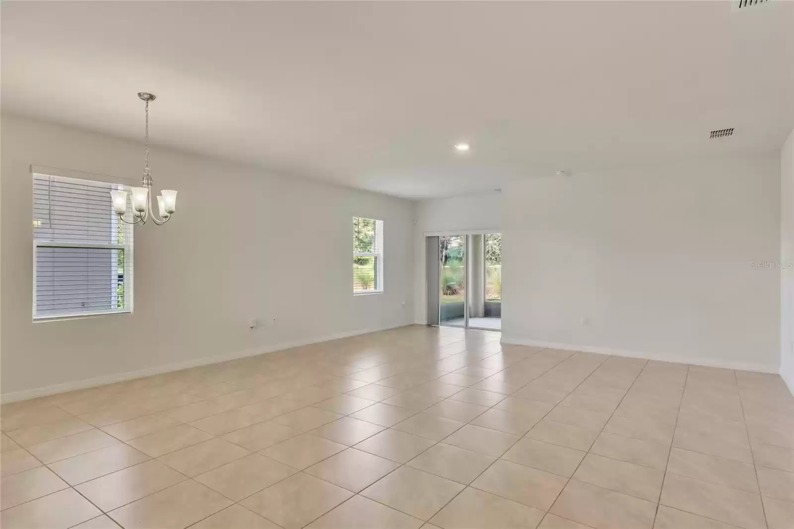 Great Room featuring Sliding Glass Doors to Screened-In Covered Patio