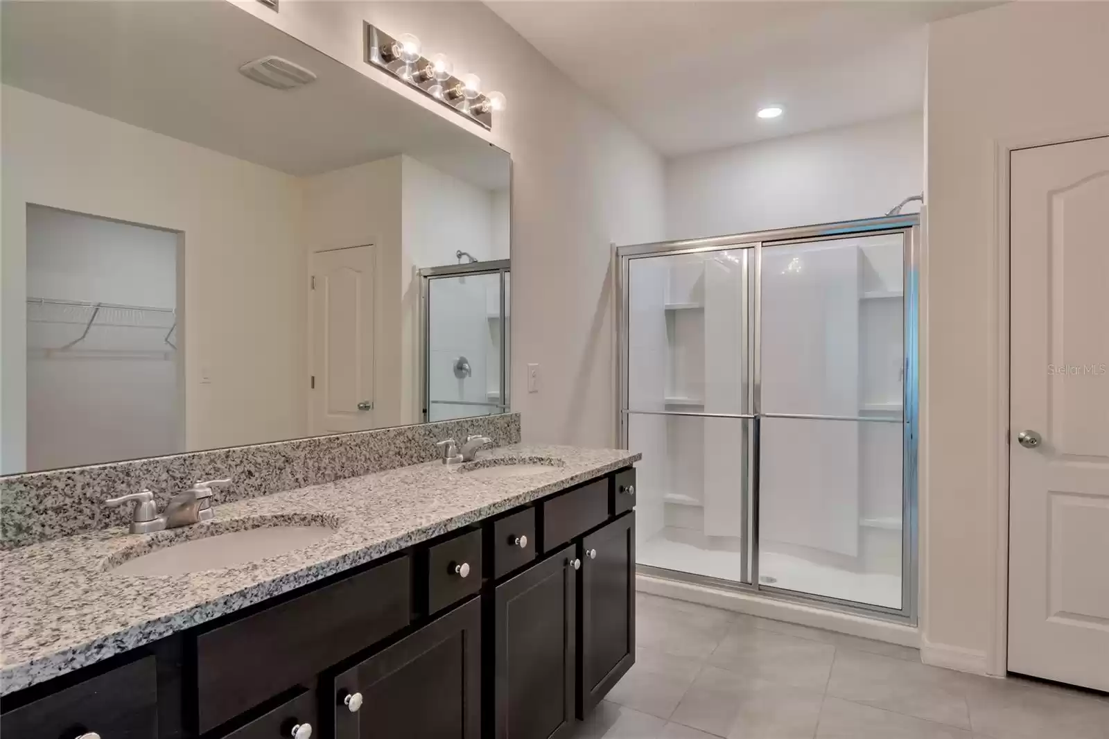 Primary Bathroom with Walk-In Shower and Double Vanity