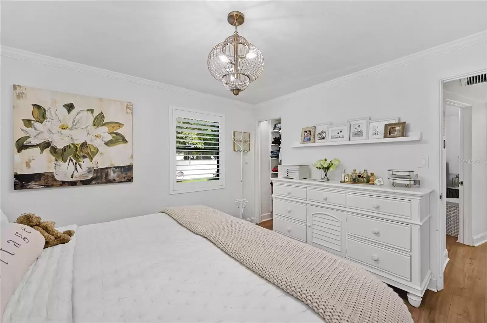 Primary bedroom, ceiling fixture and shelving do not convey.