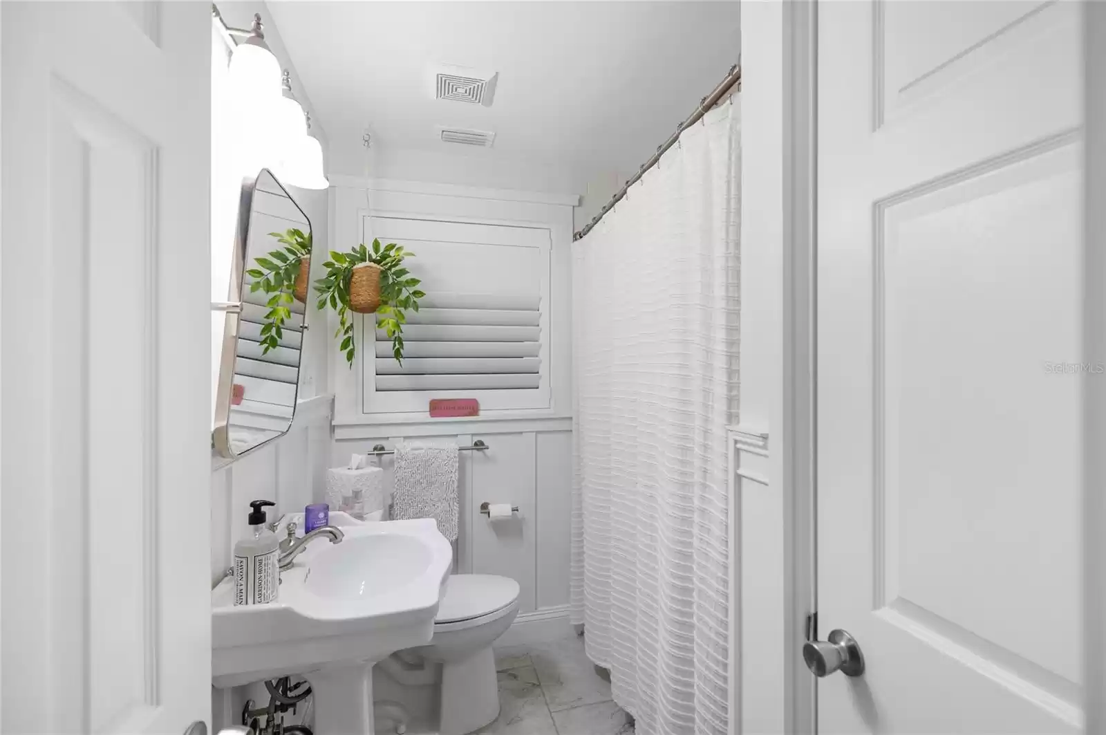 Bath, tub and shower, linen closet.