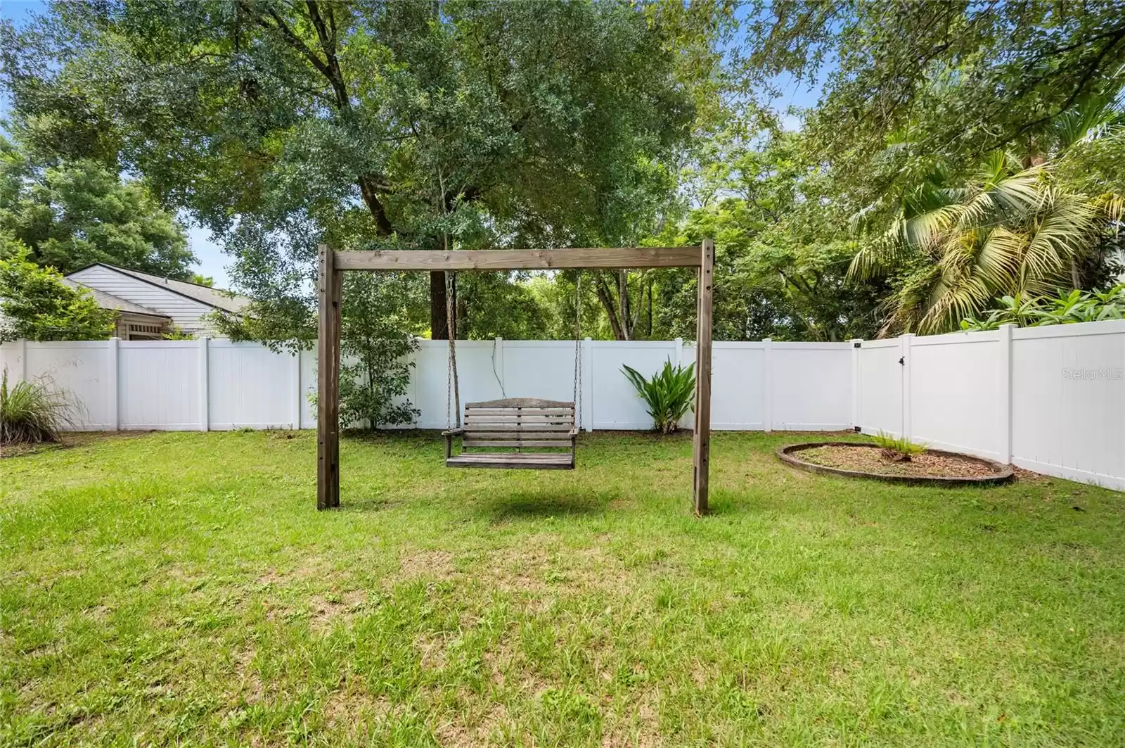 Rear yard, room for a pool, fire pit, gardening, or recreation.