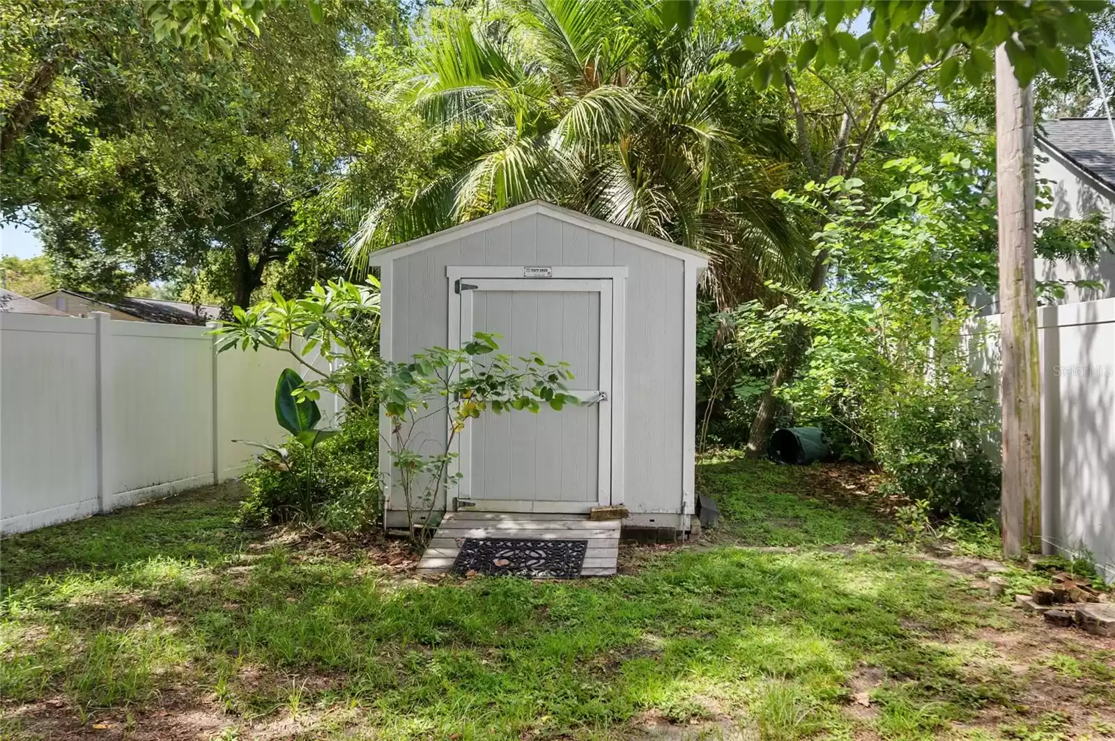 Additional storage shed beyond the rear yard.