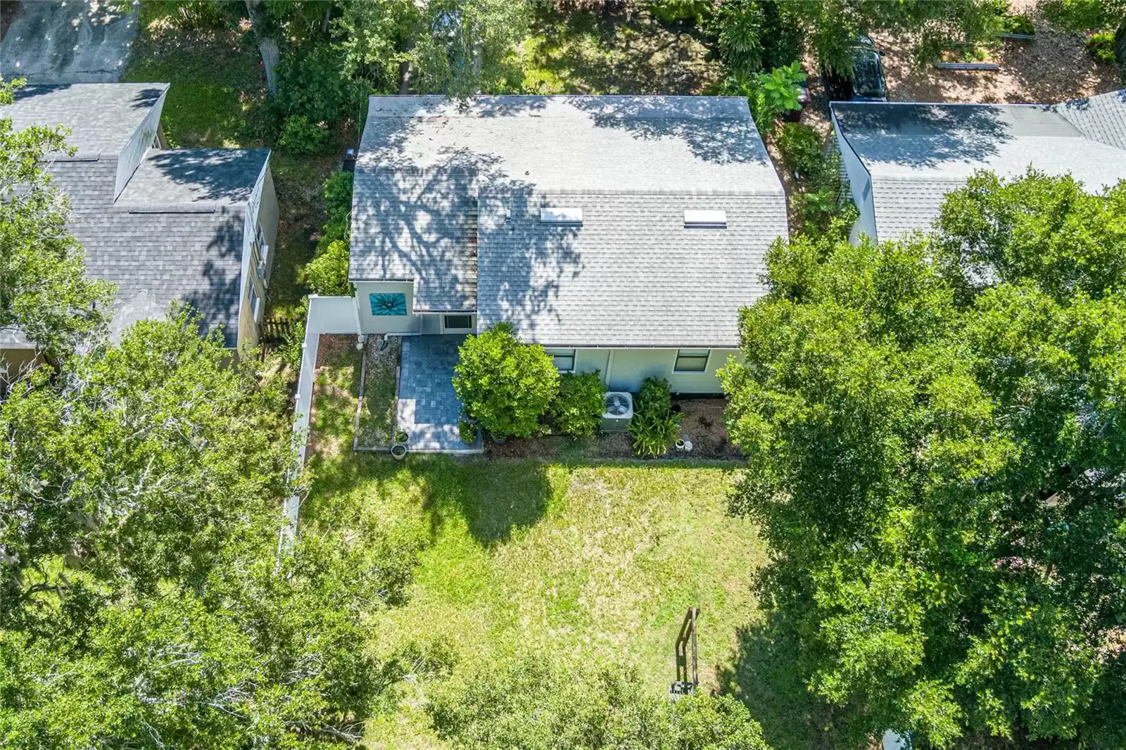 Aerial view of the rear yard and home.