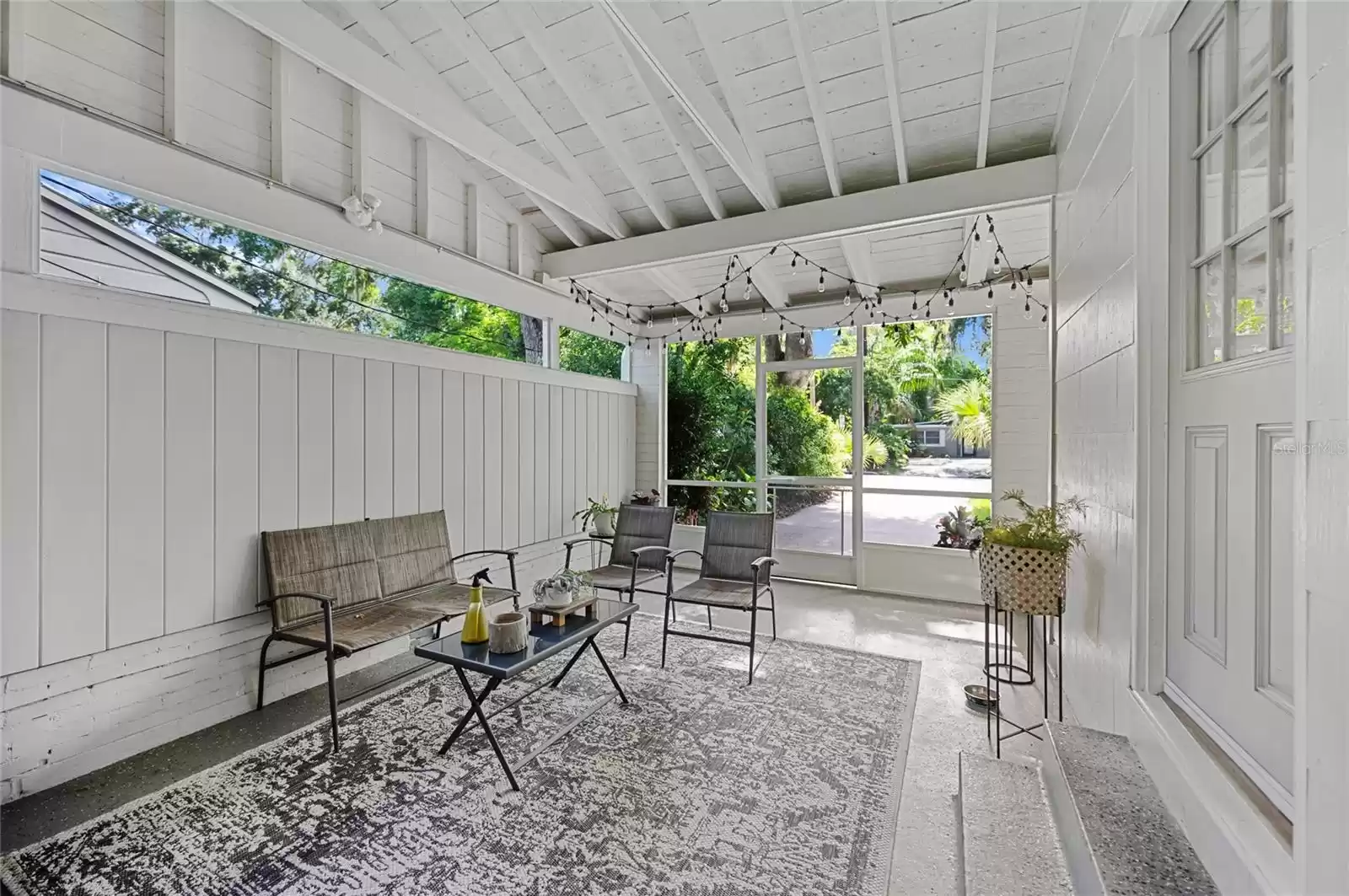 Screened in porch/patio which can be converted back into a carport.