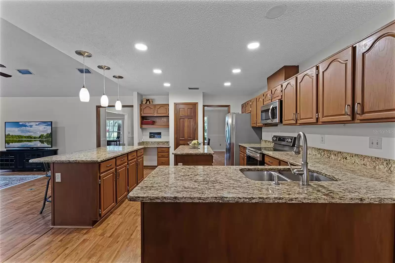 Kitchen with upgraded granite countertops and stainless steel appliances