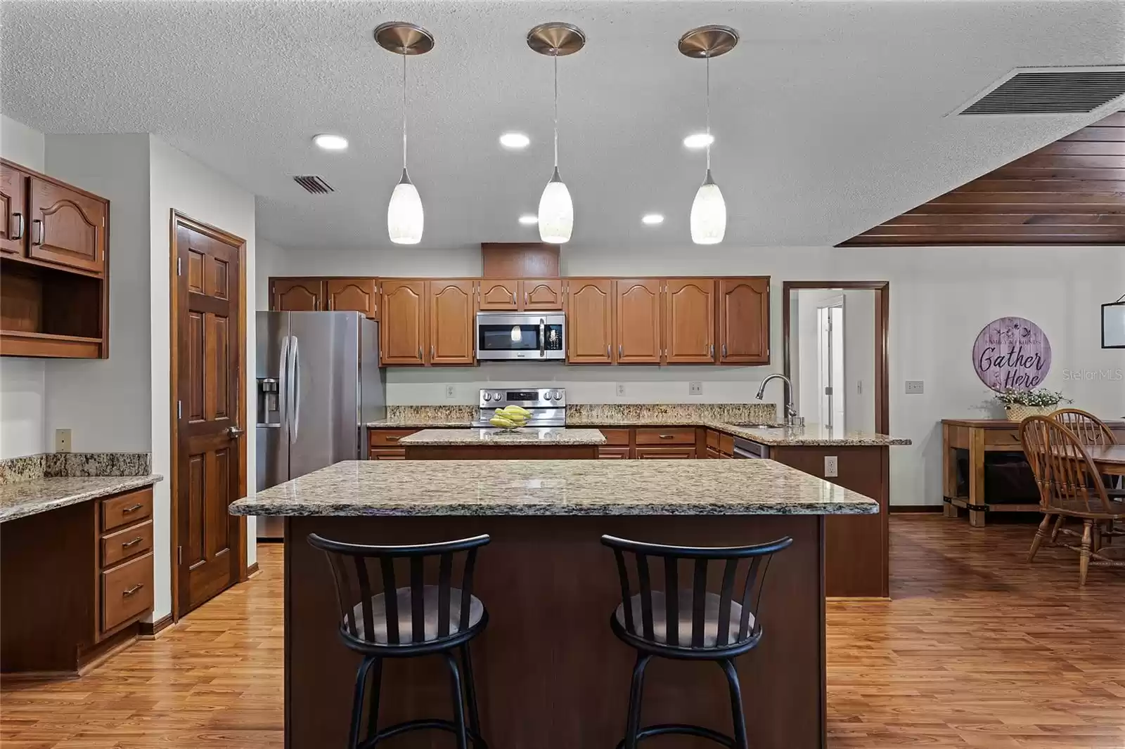 Kitchen with upgraded granite countertops and stainless steel appliances