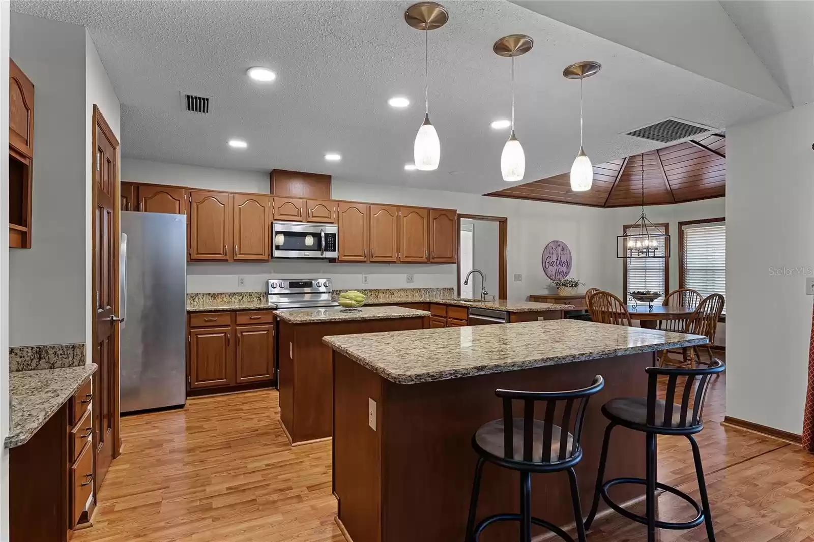 Kitchen with upgraded granite countertops and stainless steel appliances