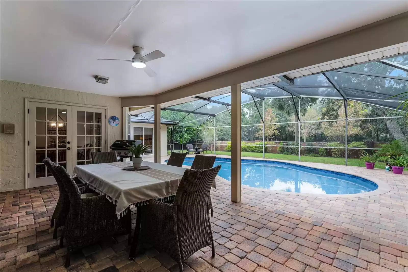 Backyard Patio with Screened in Pool