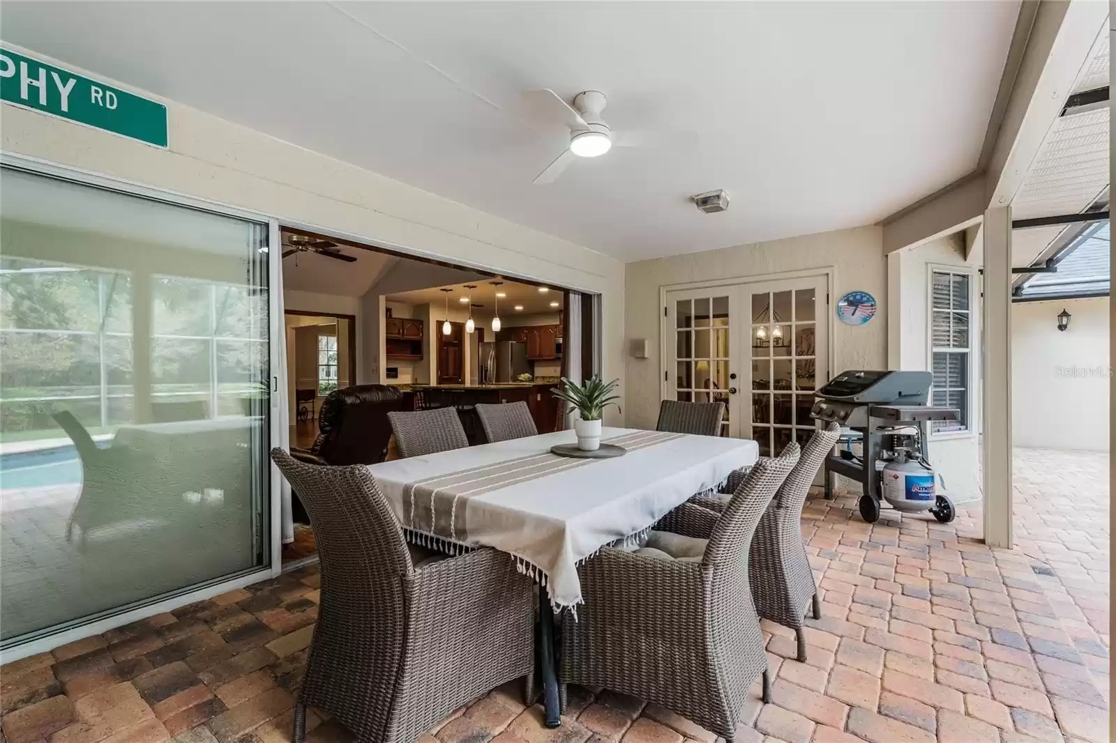 Backyard Patio with Screened in Pool