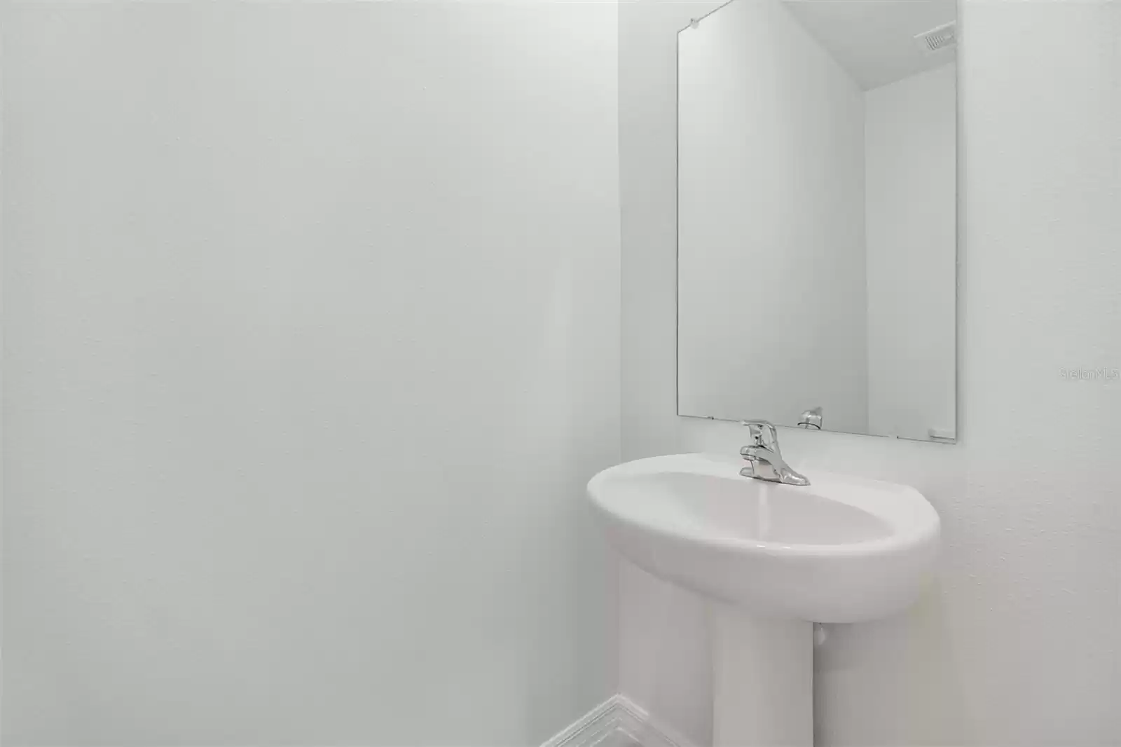 Downstairs half bath with pedestal sink!