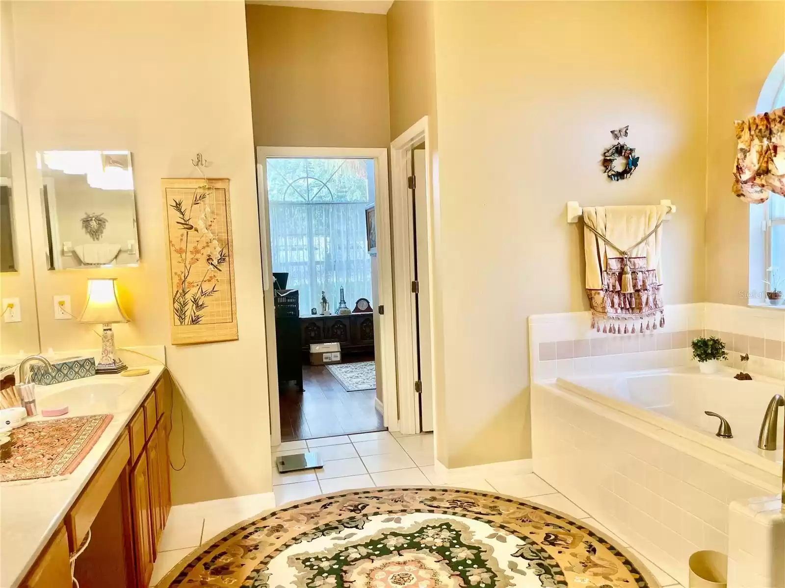 Master bath featuring HIS n' HER sinks and GARDEN TUB