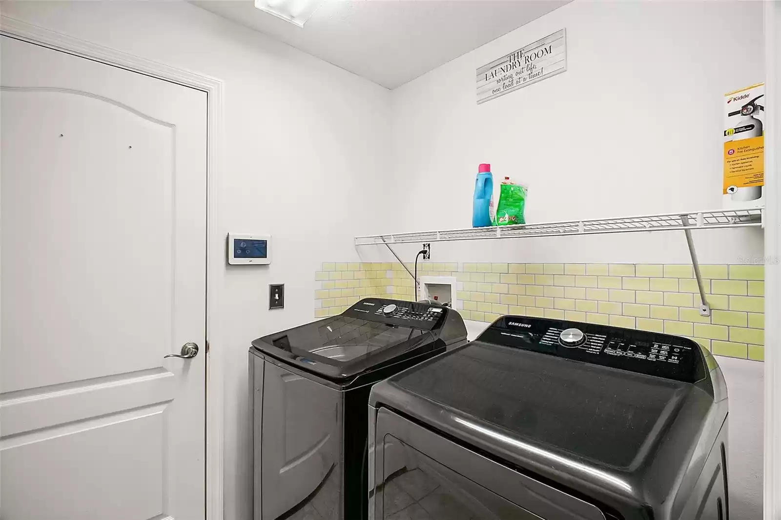 Laundry room includes washer and dryer