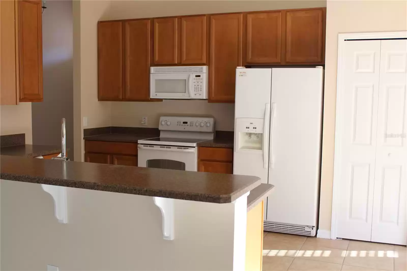 Kitchen view w/breakfast bar