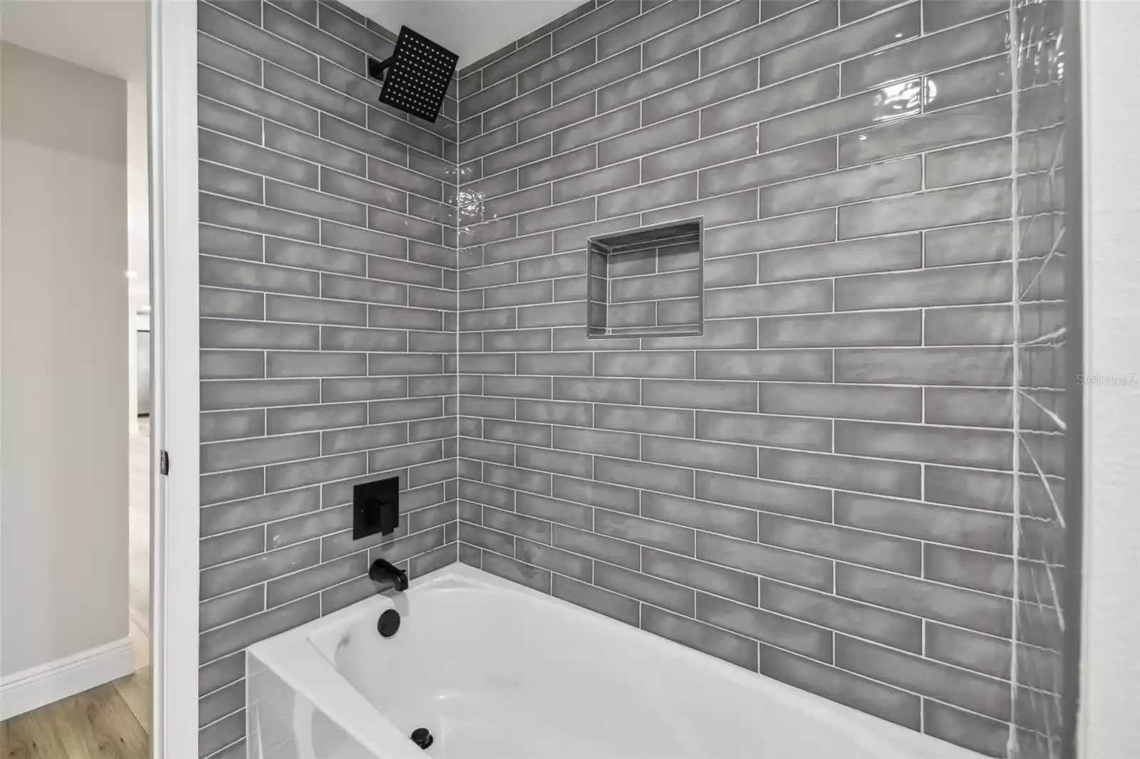 Beautiful tile and custom shampoo niche