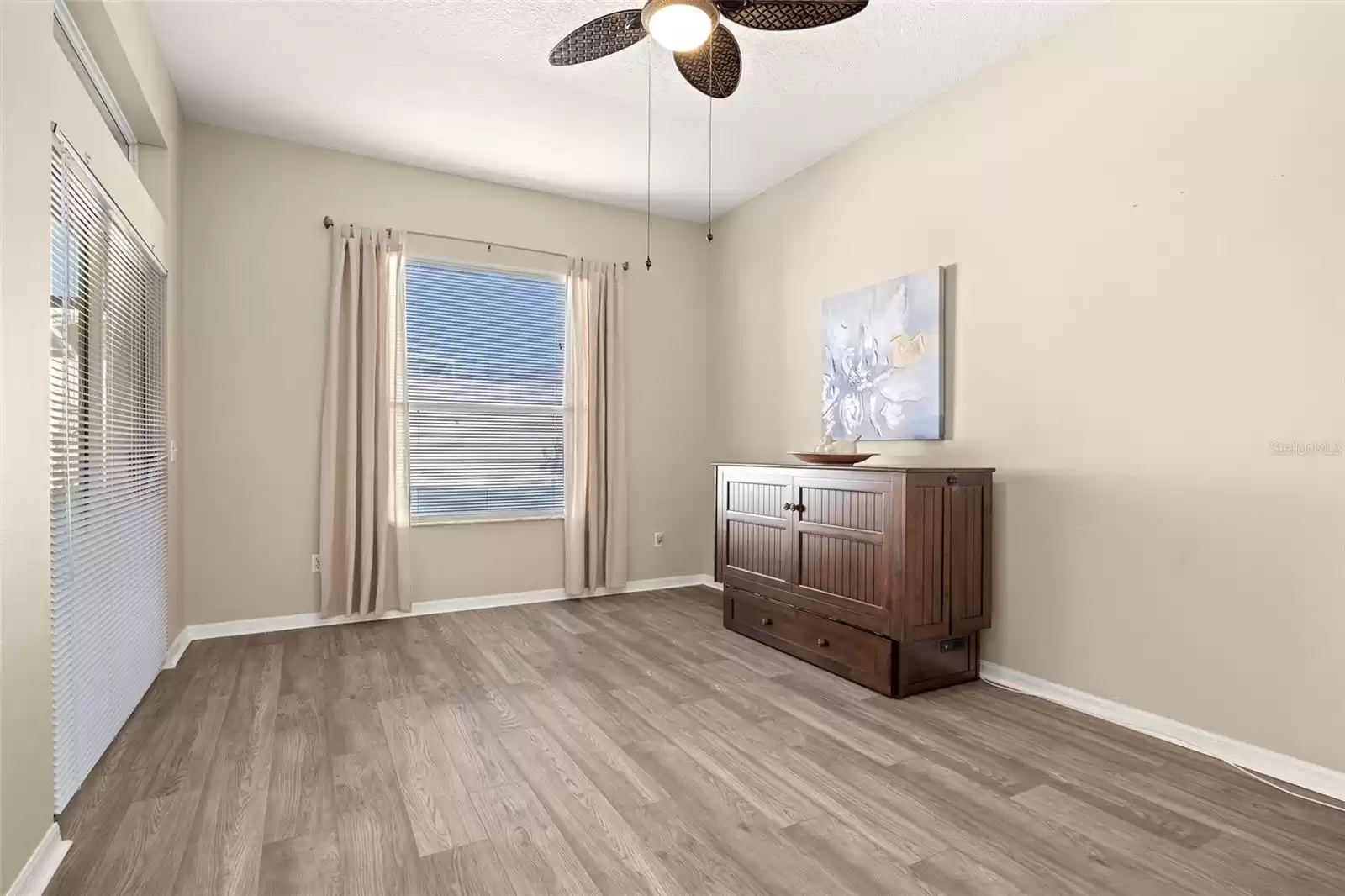 A charming Murphy bed has been added to the second guest bedroom, complete with a closet, offering flexibility for guests.