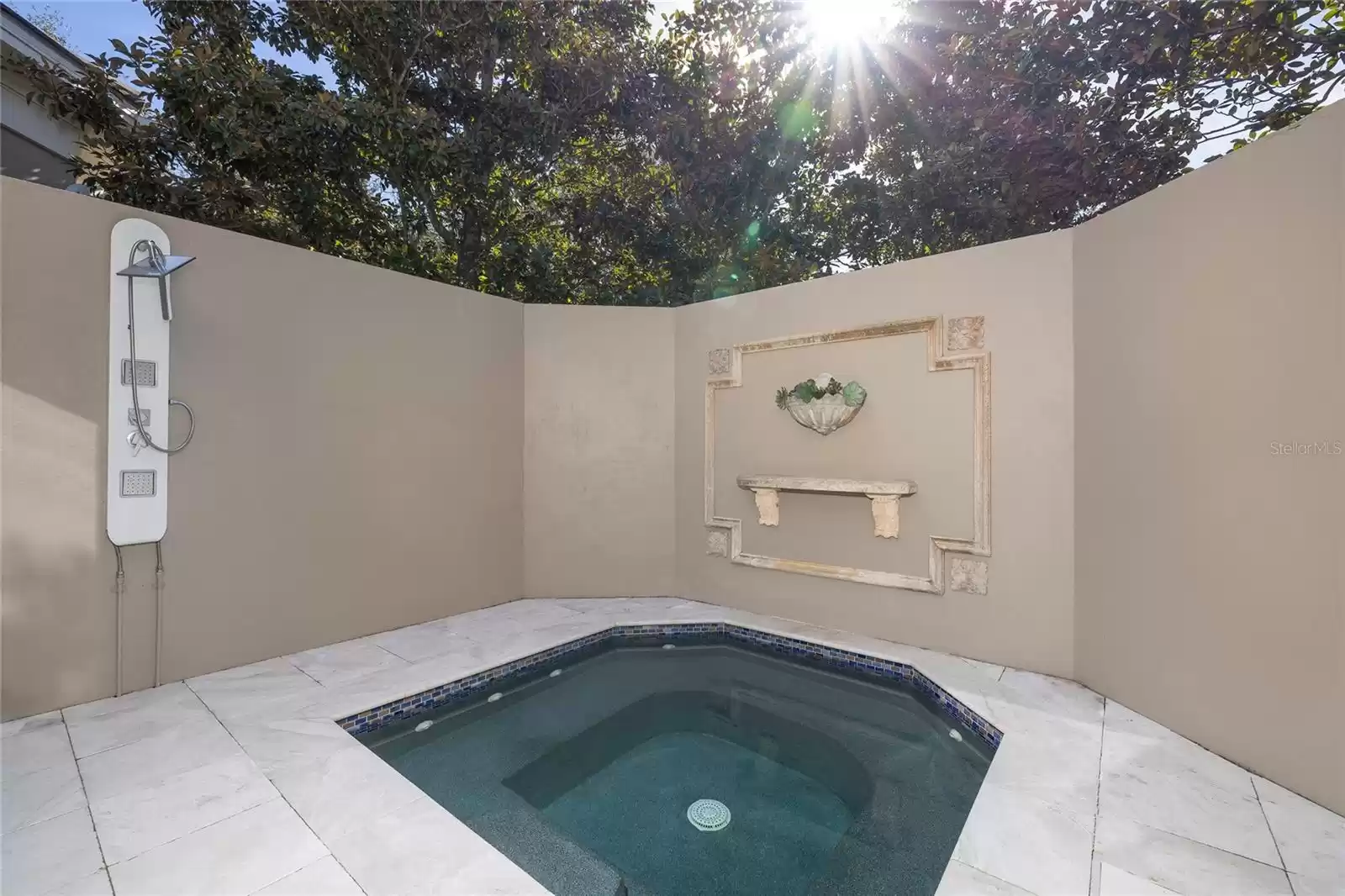 This private courtyard spa is accessed from the primary bedroom suite bath.