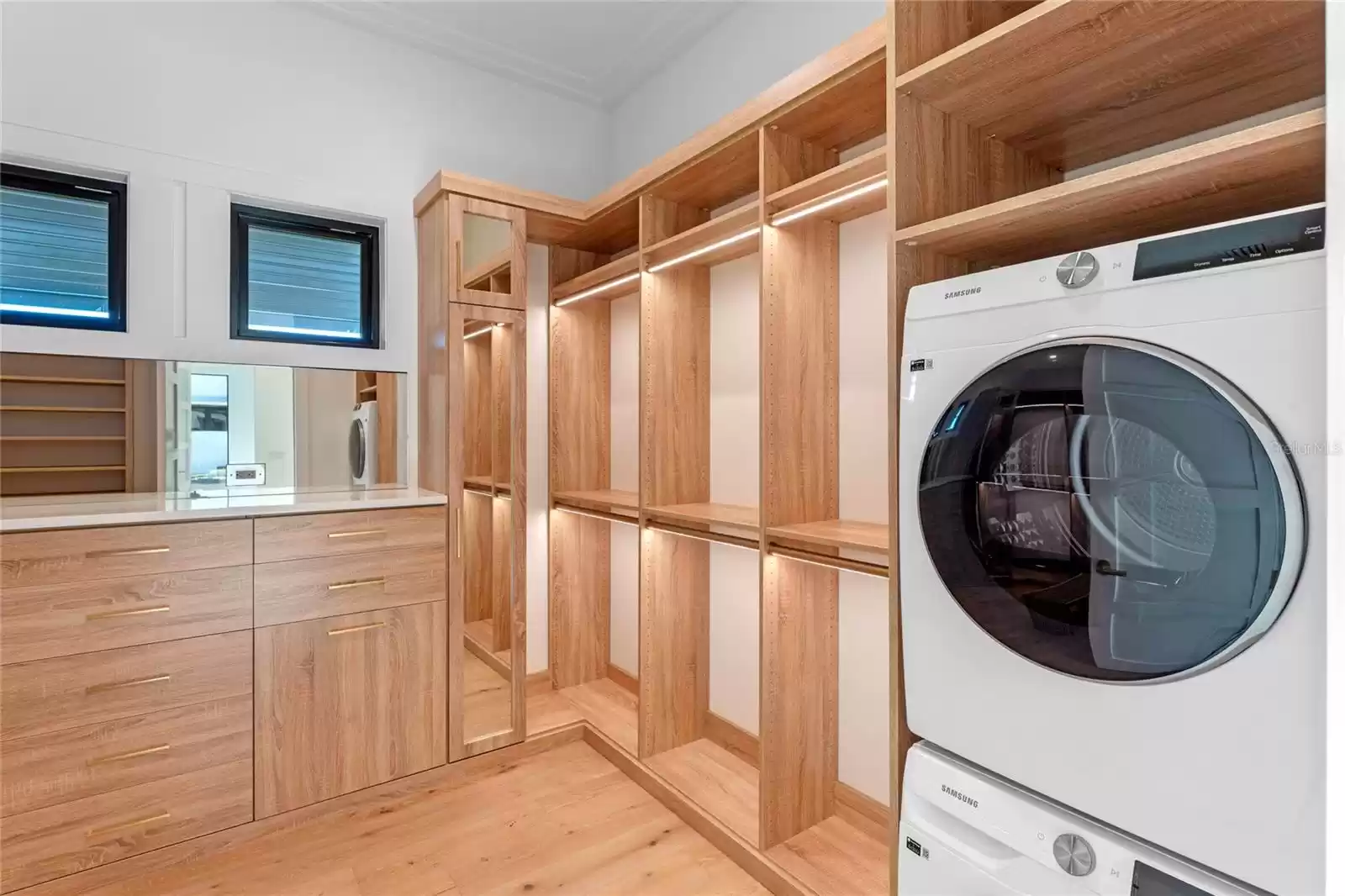 Master bedroom closet with laundry