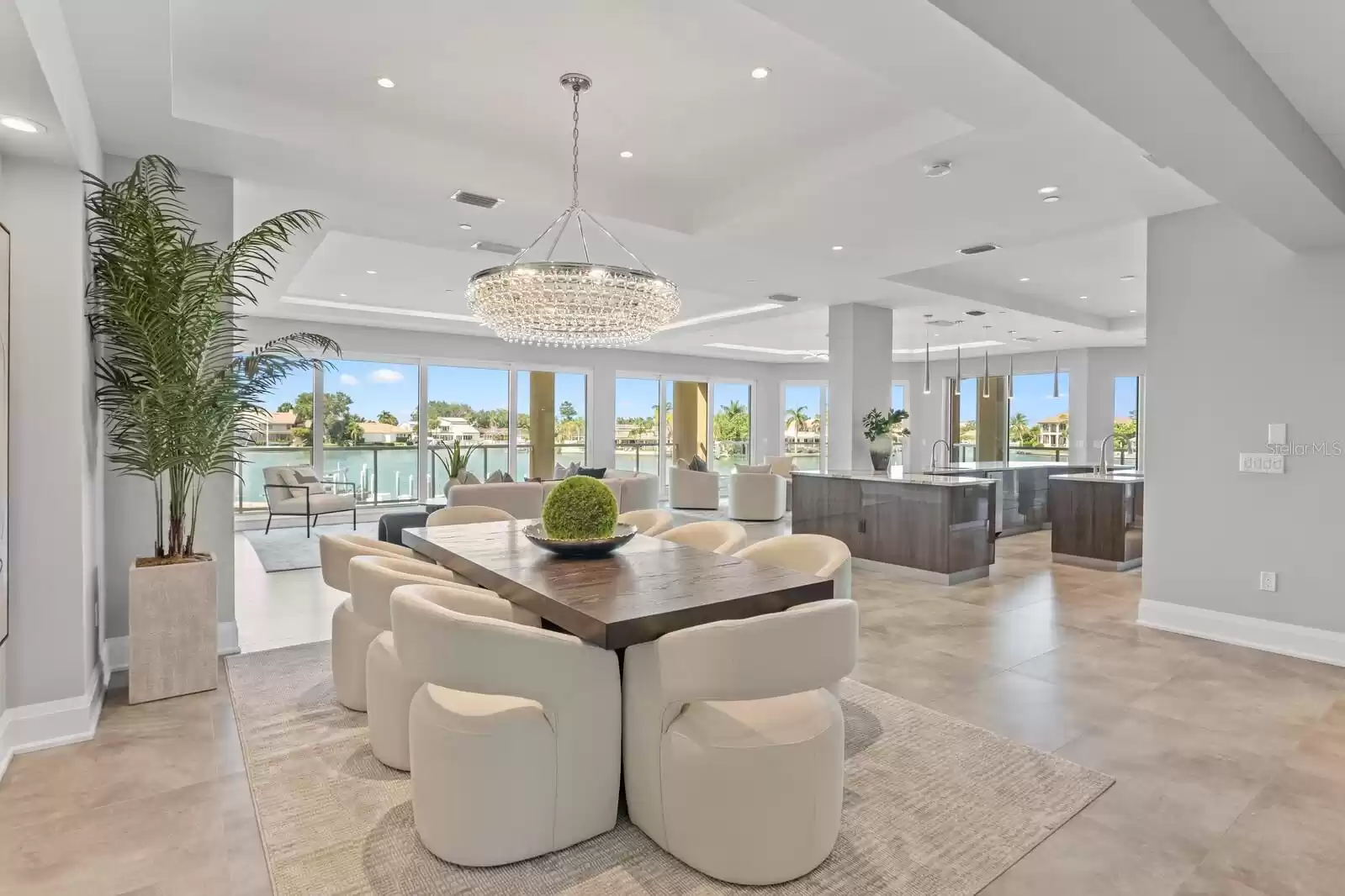 In Dining Room looking toward 41' Great Room in the distance, Kitchen on the right, all overlooking Boca Ciega Bay.