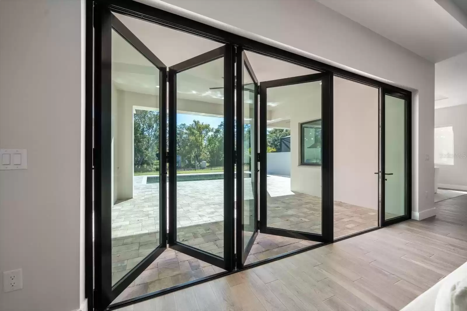 Accordion Sliding Glass Doors for seamless indoor/outdoor living.