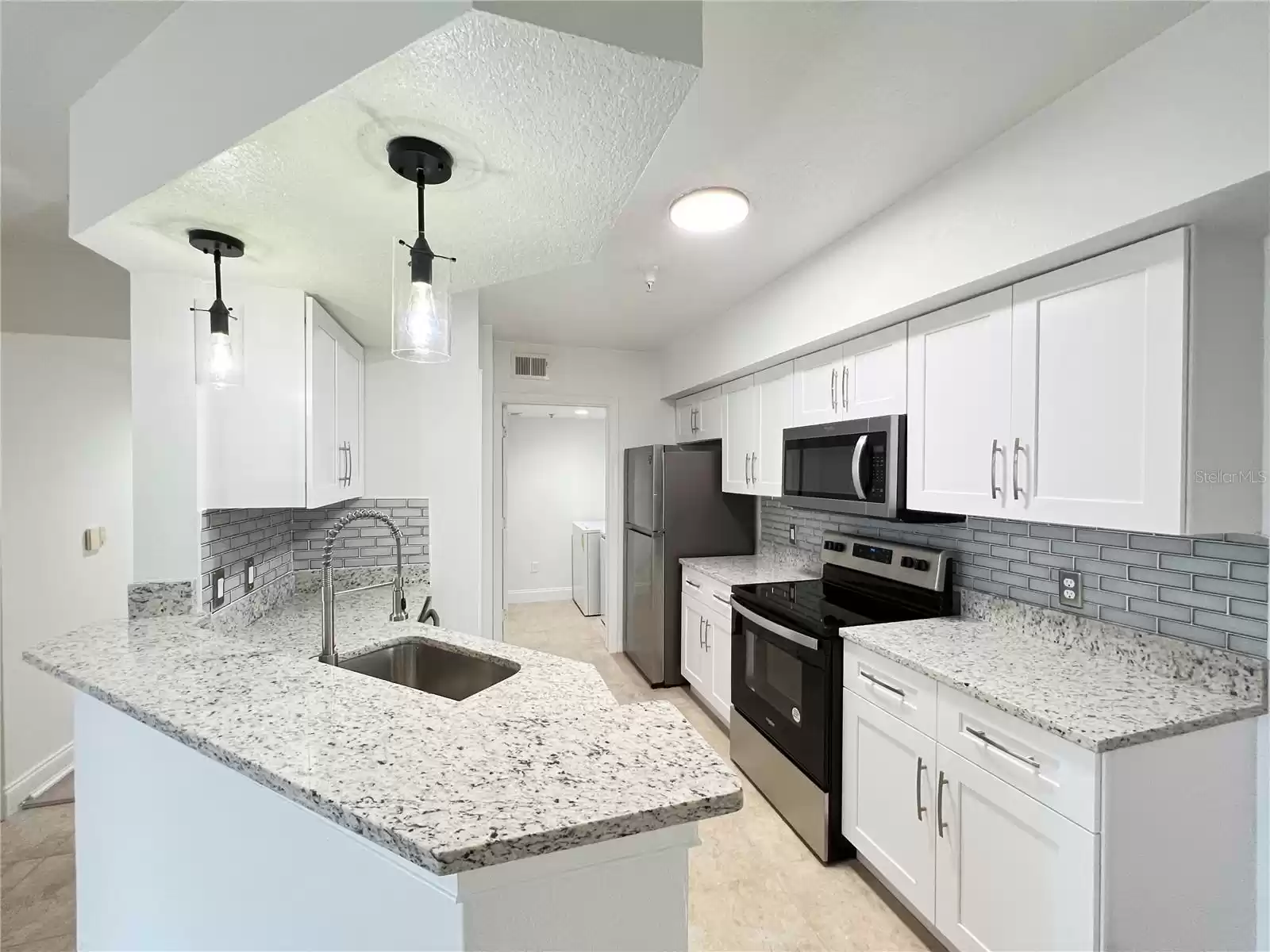 Beautiful White Kitchen with Granite Countertops